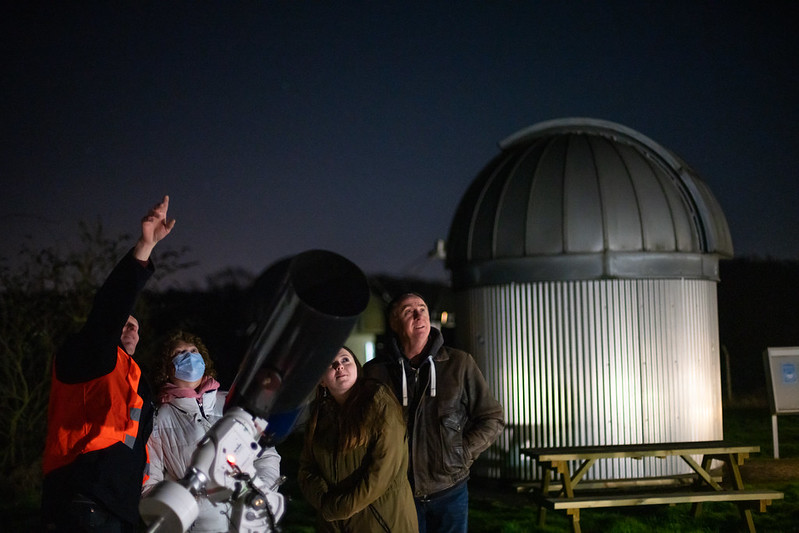 people being guided at stargazing