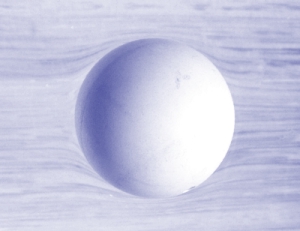 Surface distortion from a floating ping-pong ball